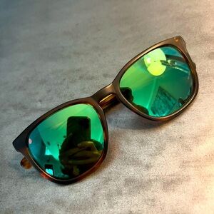 Green Costa Sullivan Sunglasses 580 with brown frames.
